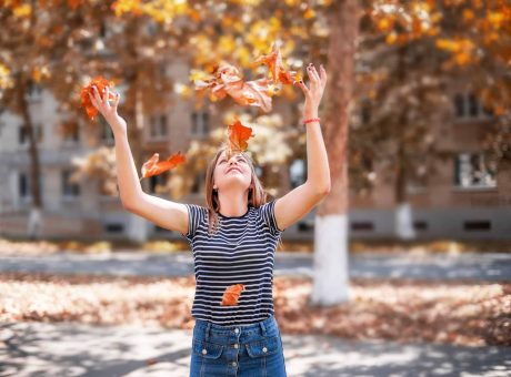 woman-throwing-yellow-leaves.jpg